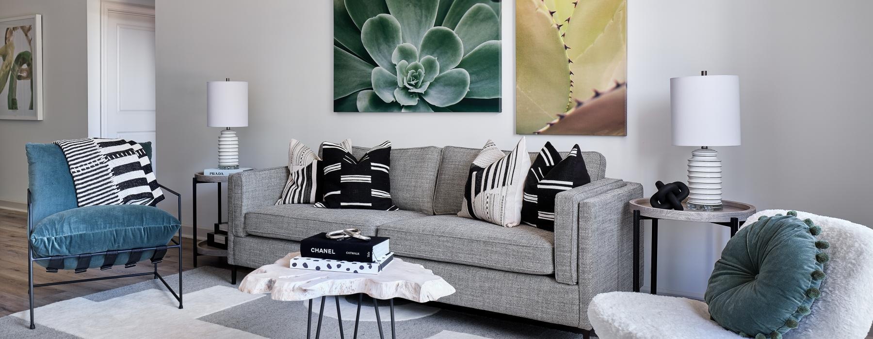 a living room with a couch and chairs
