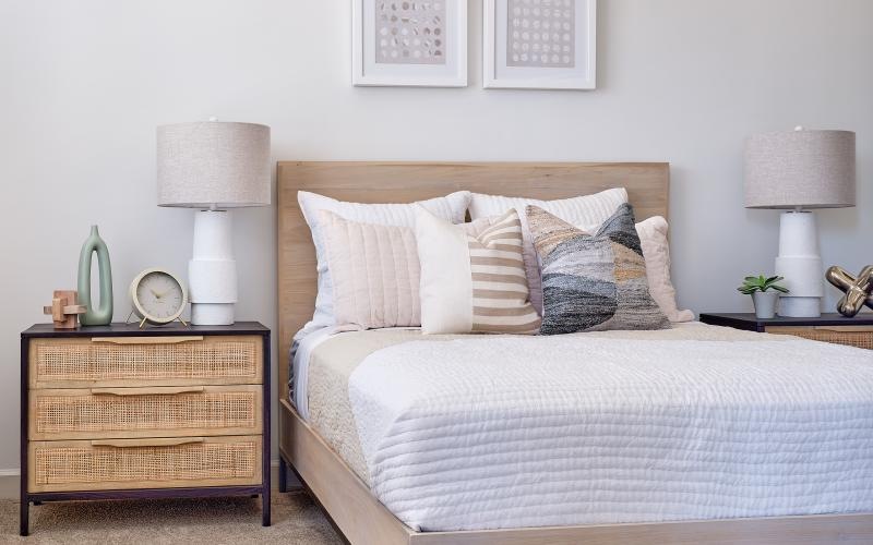a bed with white pillows