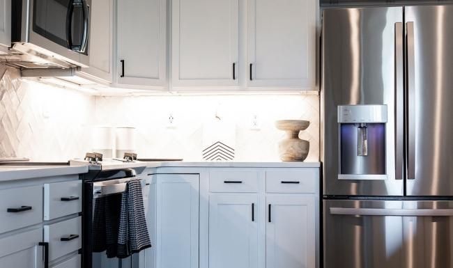 a kitchen with white cabinets