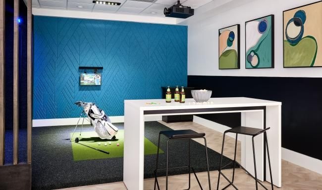 a table with chairs by golf clubs